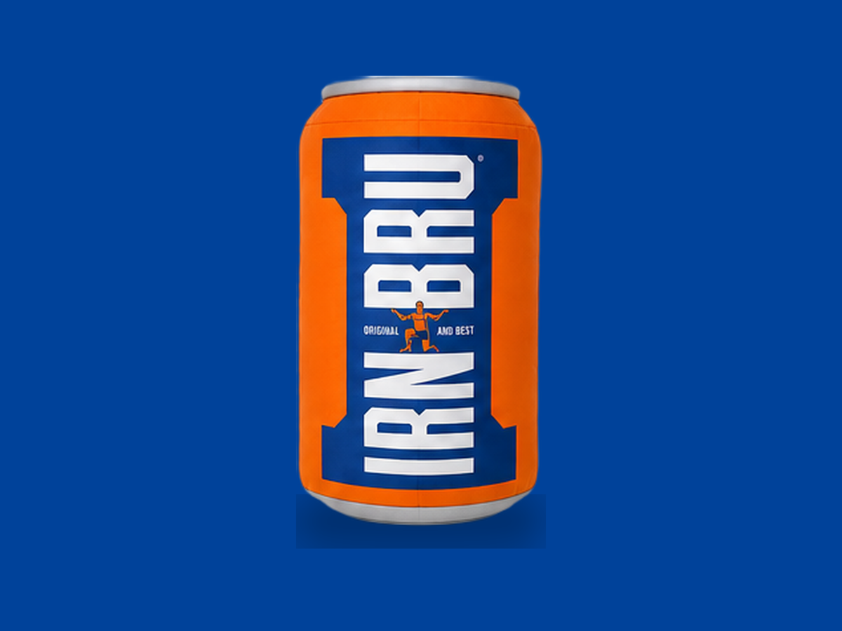 Irn-Bru Can Cushion on a blue background